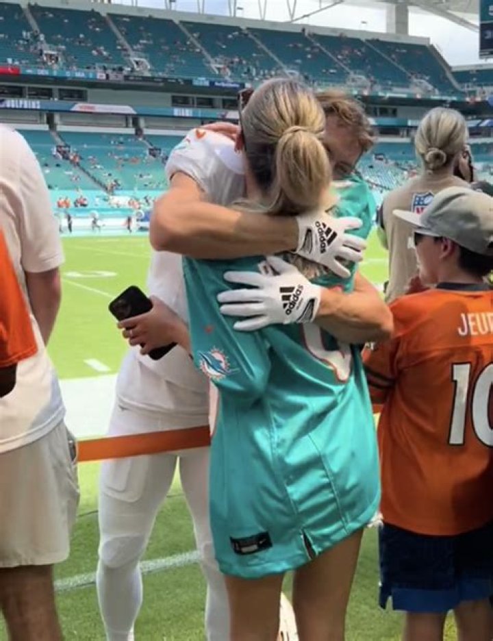 Alix Earle embraces Dolphins' Braxton Berrios during dominant win