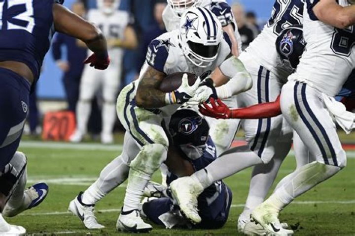 Cowboys batter banged-up Titans for 12th win of season