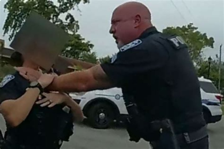 Florida cop grabs female officer by the throat after she pulled him off suspect