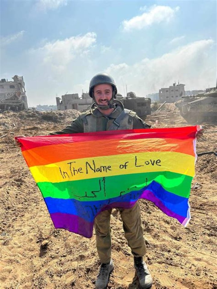 Gay Israeli soldier Yoav Atzmoni proudly displays LGBTQ flag on Gaza soil in war against Hamas