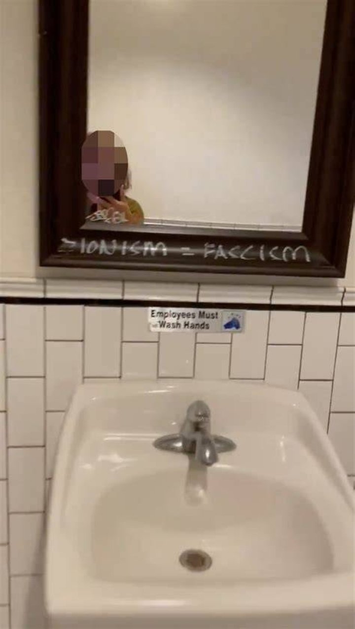 Jewish woman kicked out of cafe where staff back antisemitic graffiti