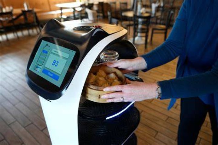 NYC restaurant turns to cat-eared robot to roll out food, draw crowd