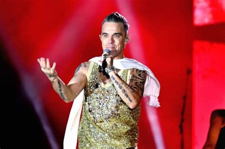 Robbie Williams concertgoer fighting for her life after fall during show