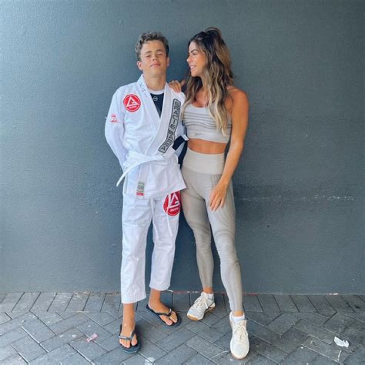 Shamed mom defends wearing thong bikini in photo with son, 15