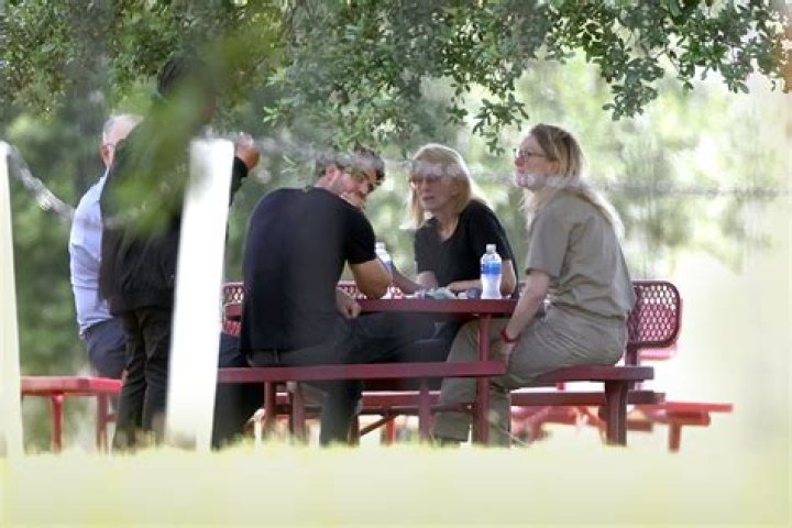Theranos fraudster Elizabeth Holmes cries during first prison visit with husband Billy Evans, parents